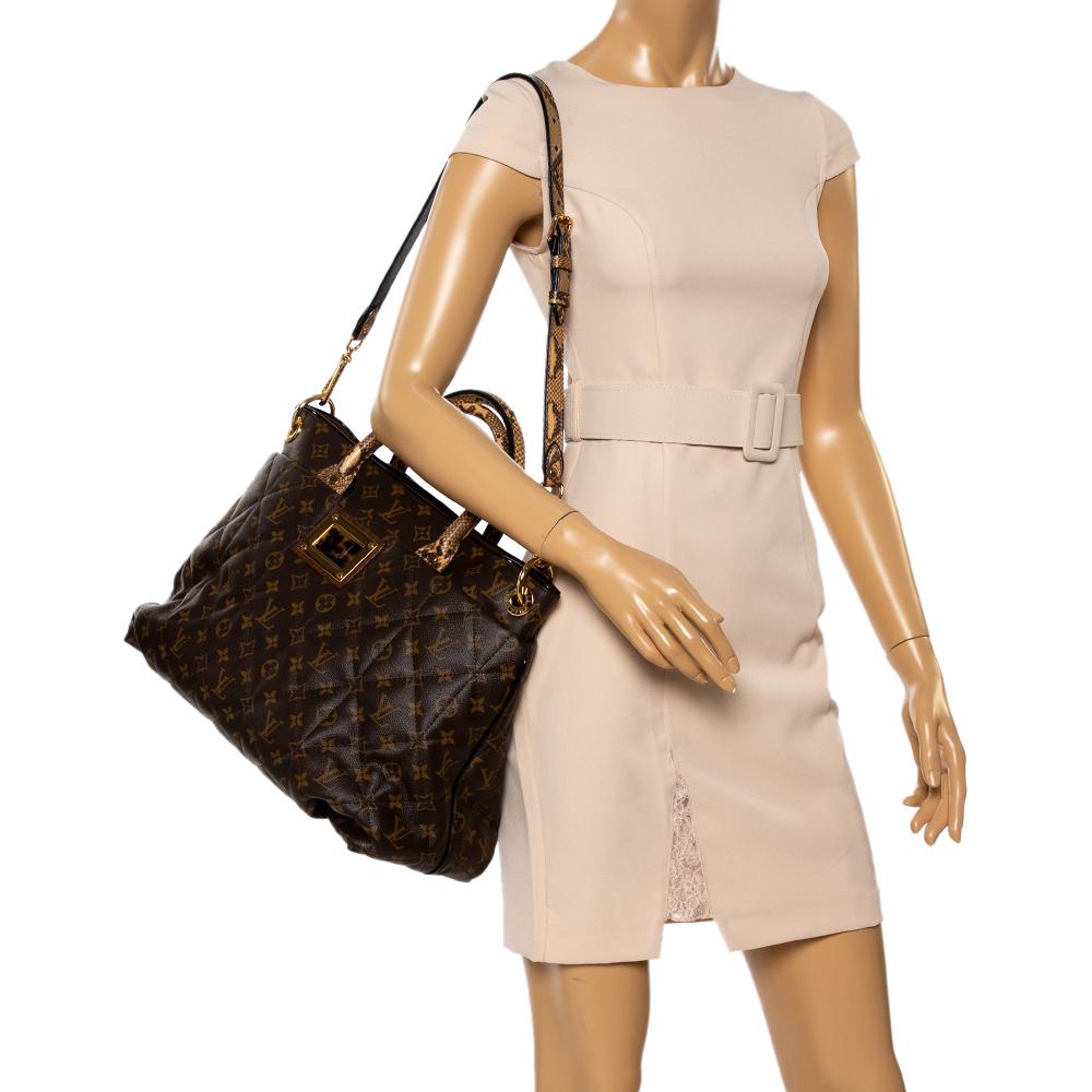 The luxurious and rare edition of the Etoile Exotique bag from Louis Vuitton is crafted in signature LV monogram canvas and has a quilted exterior. High on style and functionality, it is equipped with top handles and a detachable shoulder strap,