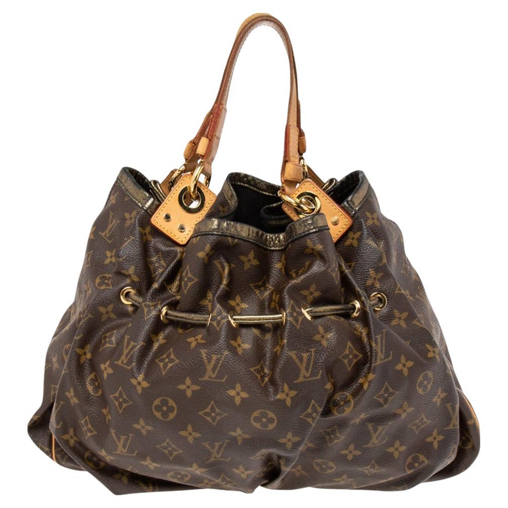 Let this exclusive piece be yours. This Louis Vuitton limited edition Irene bag has been crafted in Spain from monogram canvas and lined with Alcantara. Its exterior has a unique string detailing and metallic trims. The top leads way to a spacious