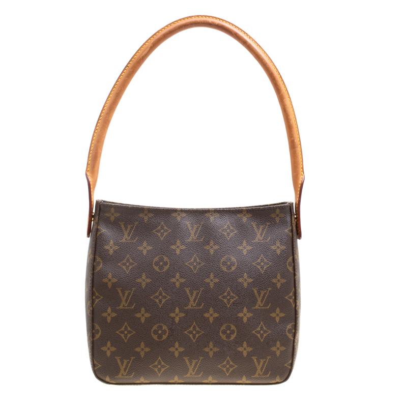 The Classic Looping bag from Louis Vuitton is an elegant way to stow your essentials. Crafted from a monogram canvas body, this bag features a top zip closure and fitted with a single rolled top handle. The spacious, Alcantara-lined interior of this