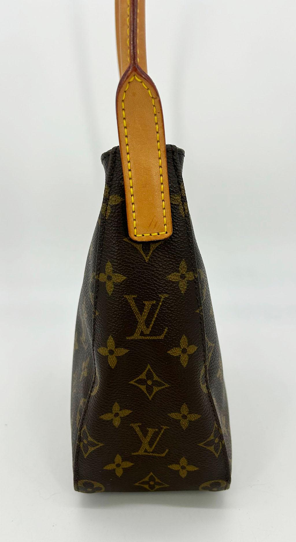 Louis Vuitton Monogram Canvas Looping MM in very good condition. Signature brown monogram canvas body with tan leather top handle and gold harrdware. Handle can fold up and down to wear or carry this piece in a variety of ways. Full top full zip