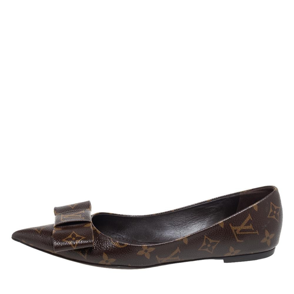 Nothing like an eccentric pair of shoes to look and feel like a diva. Crafted out of the brand's signature Monogram coated canvas, this Louis Vuitton number features a pointed-toe, leather-lined insides, and sturdy soles. The flats are adorned with