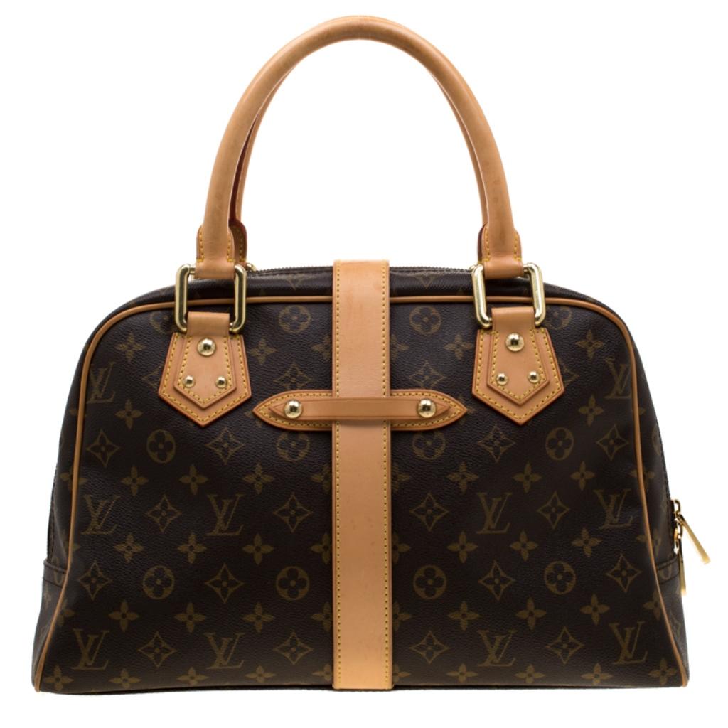 Make heads turn with a classic from Louis Vuitton’s collection of luxury bags. This Manhattan GM bag is crafted with monogram coated canvas and features two external pockets with push lock closure, leather trim, and a strap with buckle closure. The