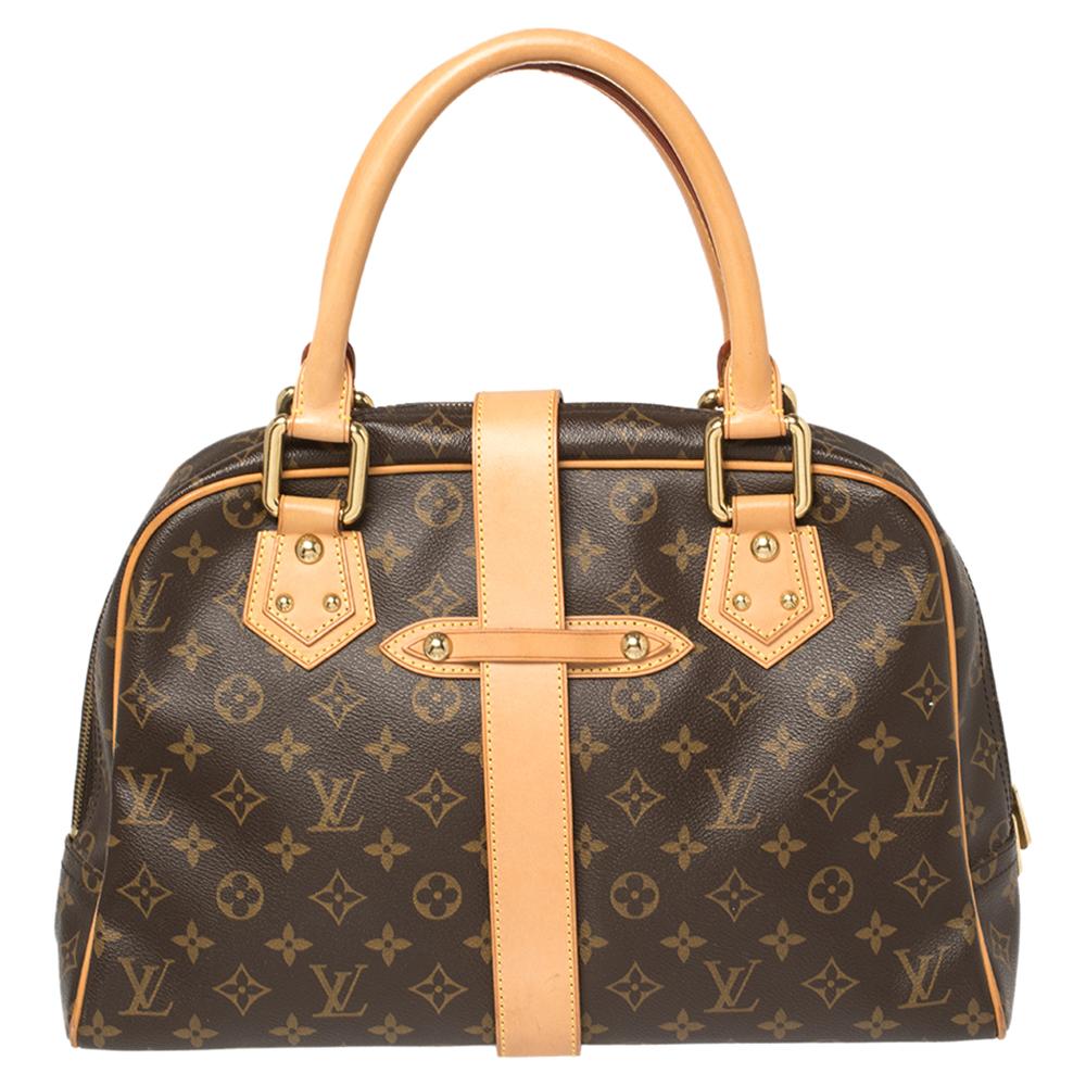This Louis Vuitton Manhattan bag is crafted from monogram canvas and accentuated with leather trims and gold-tone hardware. It features dual handles, two front pockets, and an Alcantara-lined interior. Made in France, this bag—with its classic shape