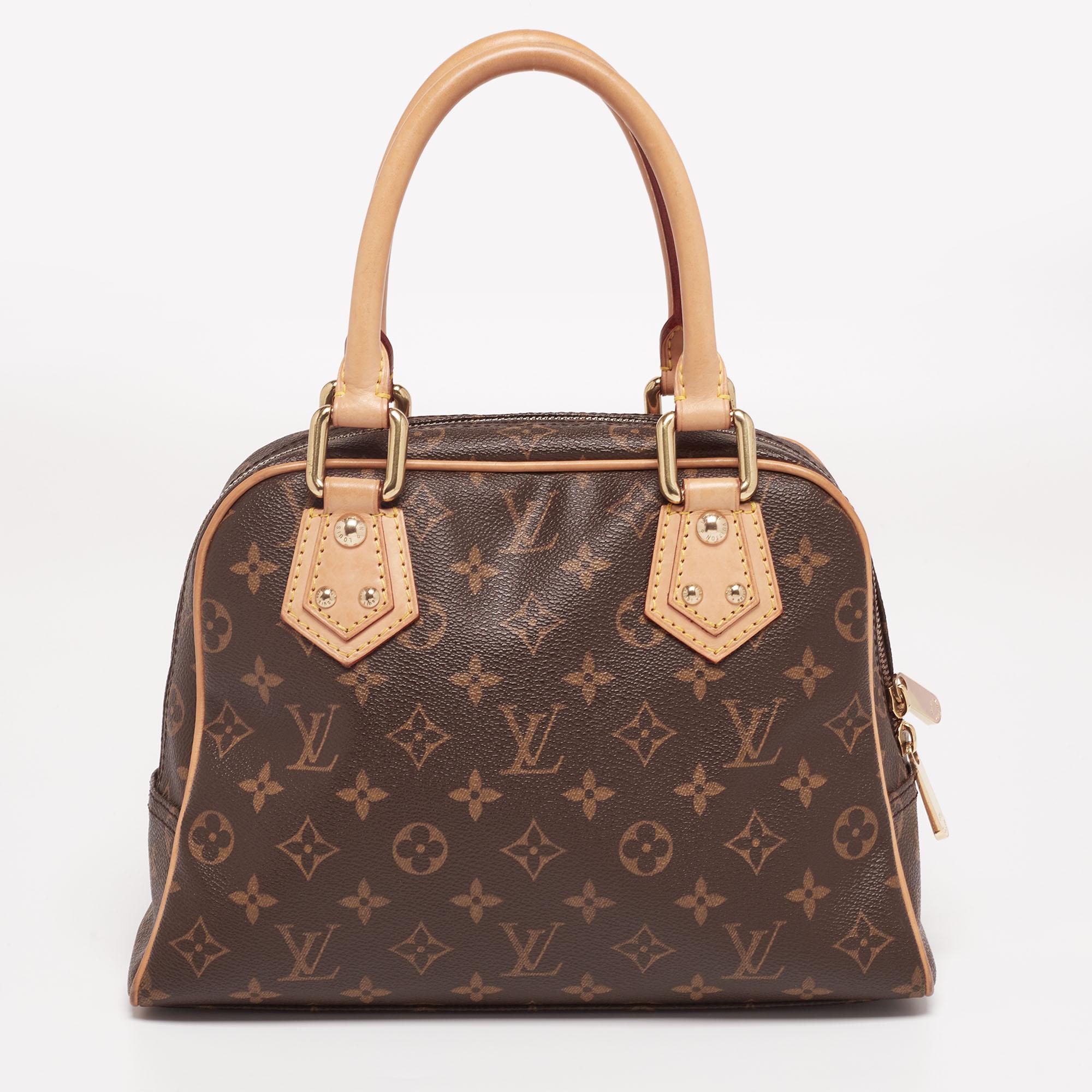 Own this gorgeous Manhattan PM Bag by Louis Vuitton today and flaunt it wherever you go. The bag has been crafted from signature Monogram canvas and lined with Alcantara on the insides. It is equipped with two push-lock pockets on the front, a main