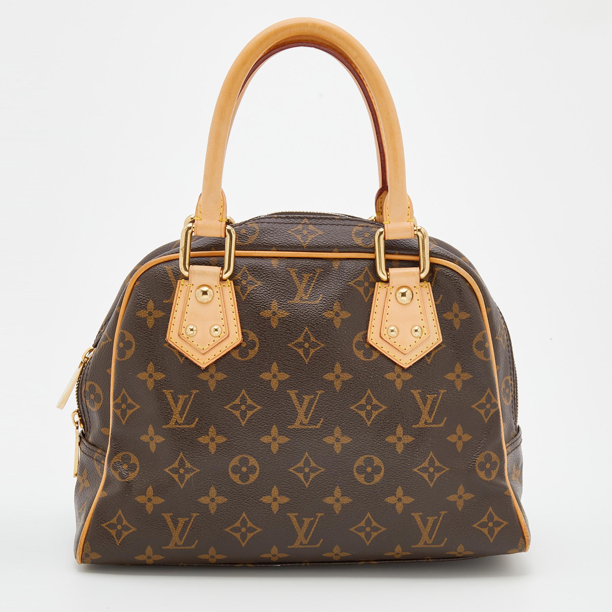 This Louis Vuitton bag is a must-have among all fashionistas! It is crafted from coated canvas and leather with beautiful gold-tone details and two cute front pockets. The zip closure opens into a neat spacious interior to carry your essentials with