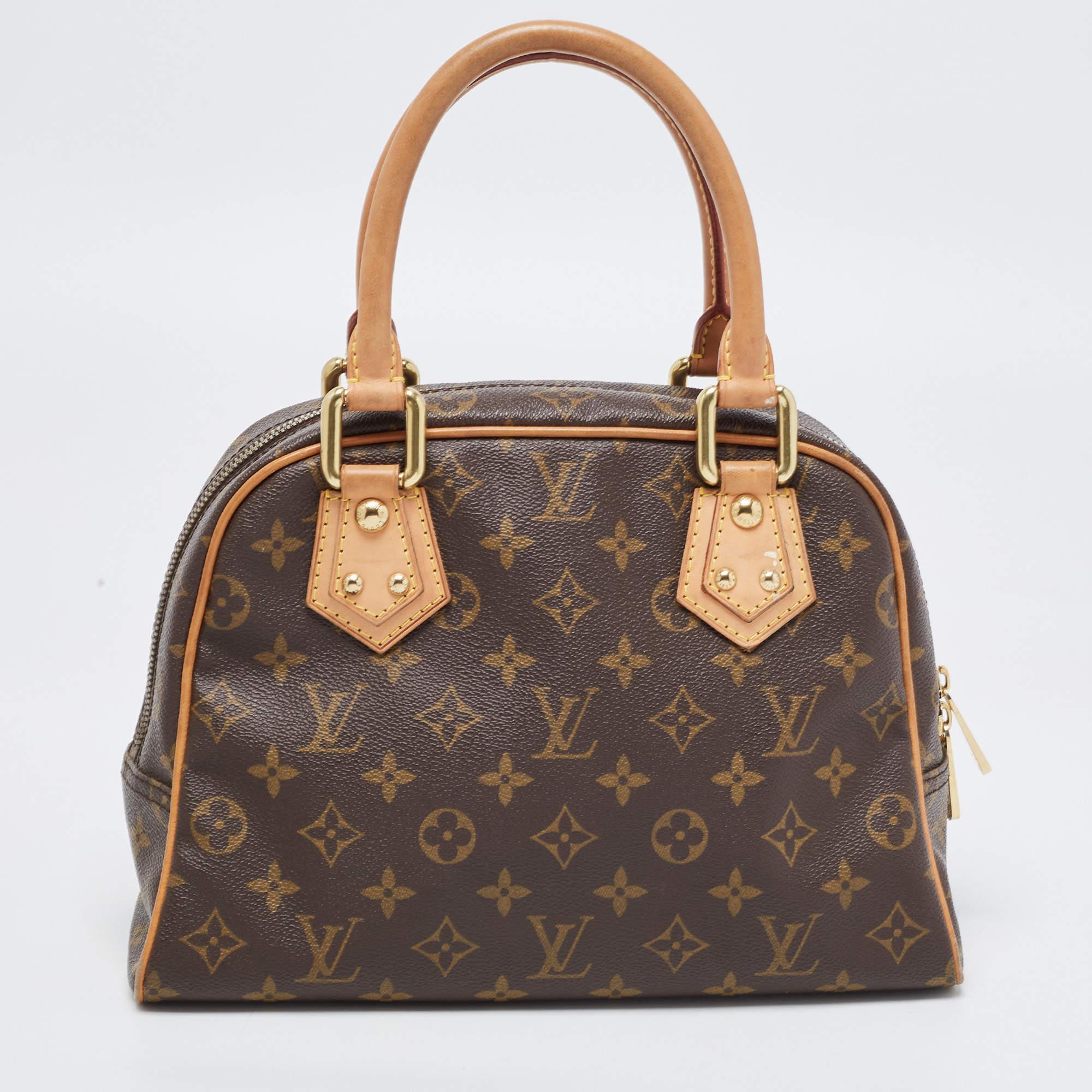 This Louis Vuitton Manhattan PM tote promises to take you through the day with ease, whether you're at work or out and about in the city. From its design to its structure, the Monogram canvas & leather bag promises charm and durability. It has top