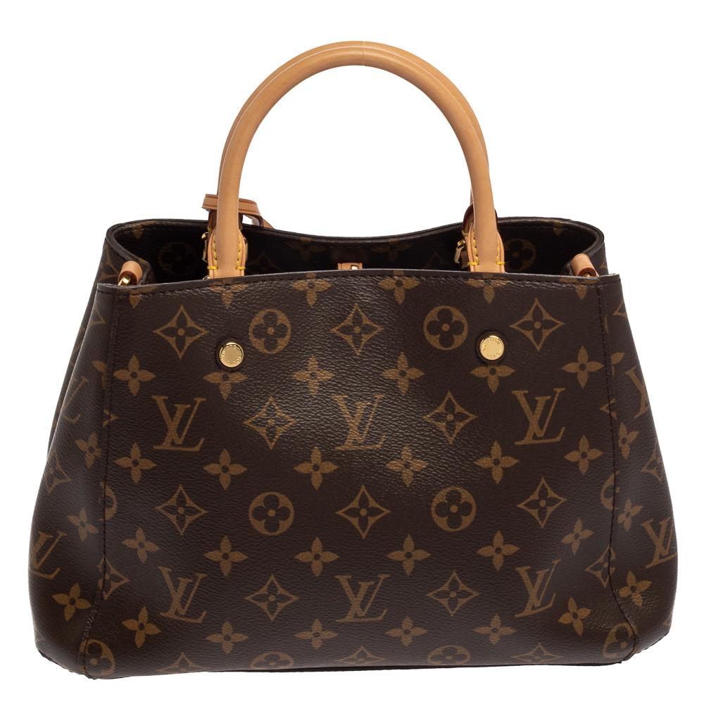 A handbag should not only be good-looking but also functional, just like this Montaigne BB bag from Louis Vuitton. Crafted from Monogram canvas & leather, this gorgeous number has a spacious Alcantara interior that is divided by a zip compartment.