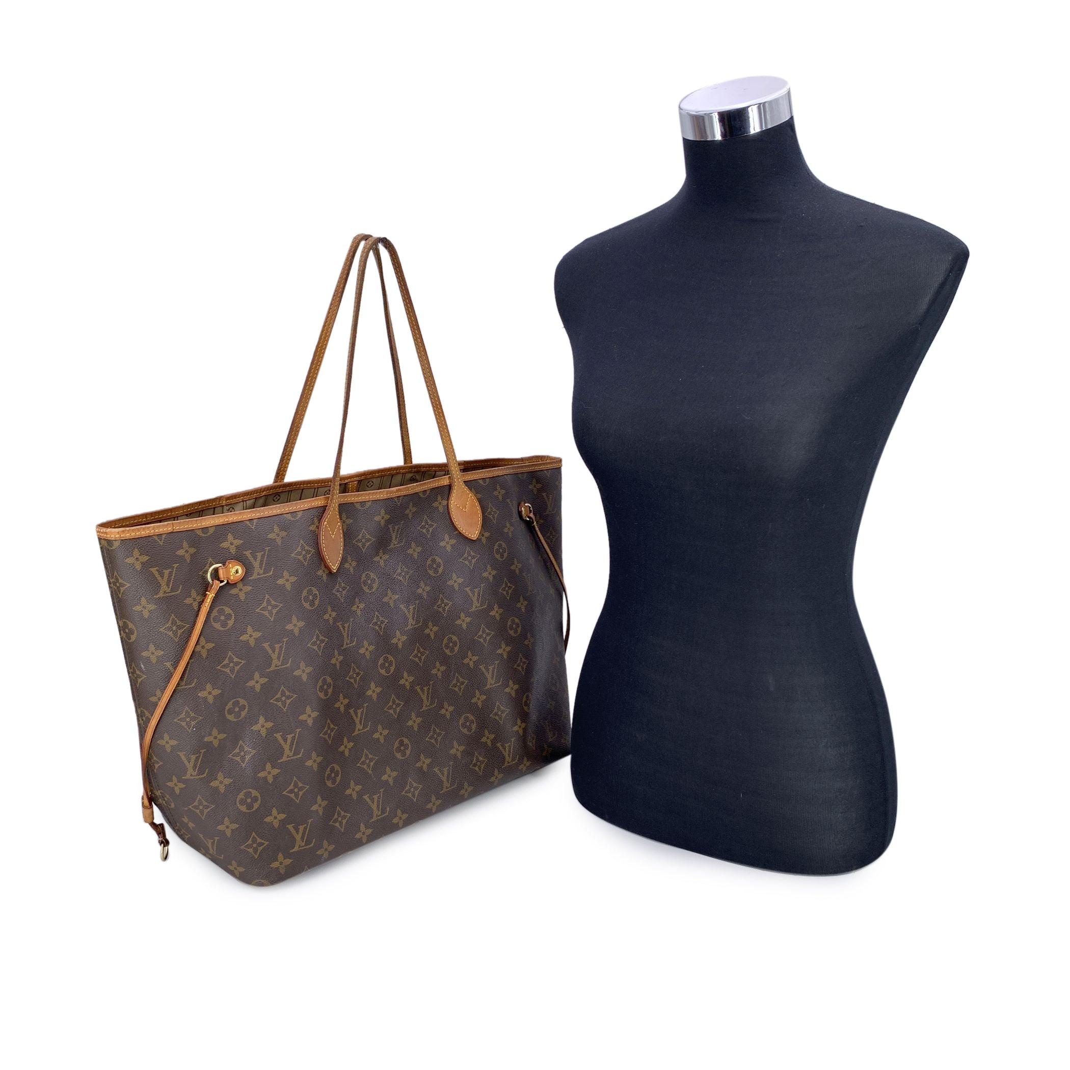 This beautiful Bag will come with a Certificate of Authenticity provided by Entrupy. The certificate will be provided at no further cost Louis Vuitton Neverfull GM Tote Bag. Monogram canvas with leather trim and handles. Open top. Fabric lining with