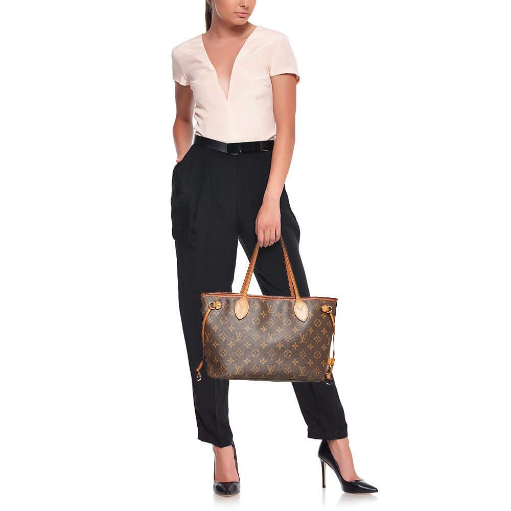 Introduced in 2007 the Neverfull by Louis Vuitton is applauded for its innovative design and faultless craftsmanship. This PM bag comes crafted from the Monogram canvas and leather and its classy features contribute to its timeless elegance. With a