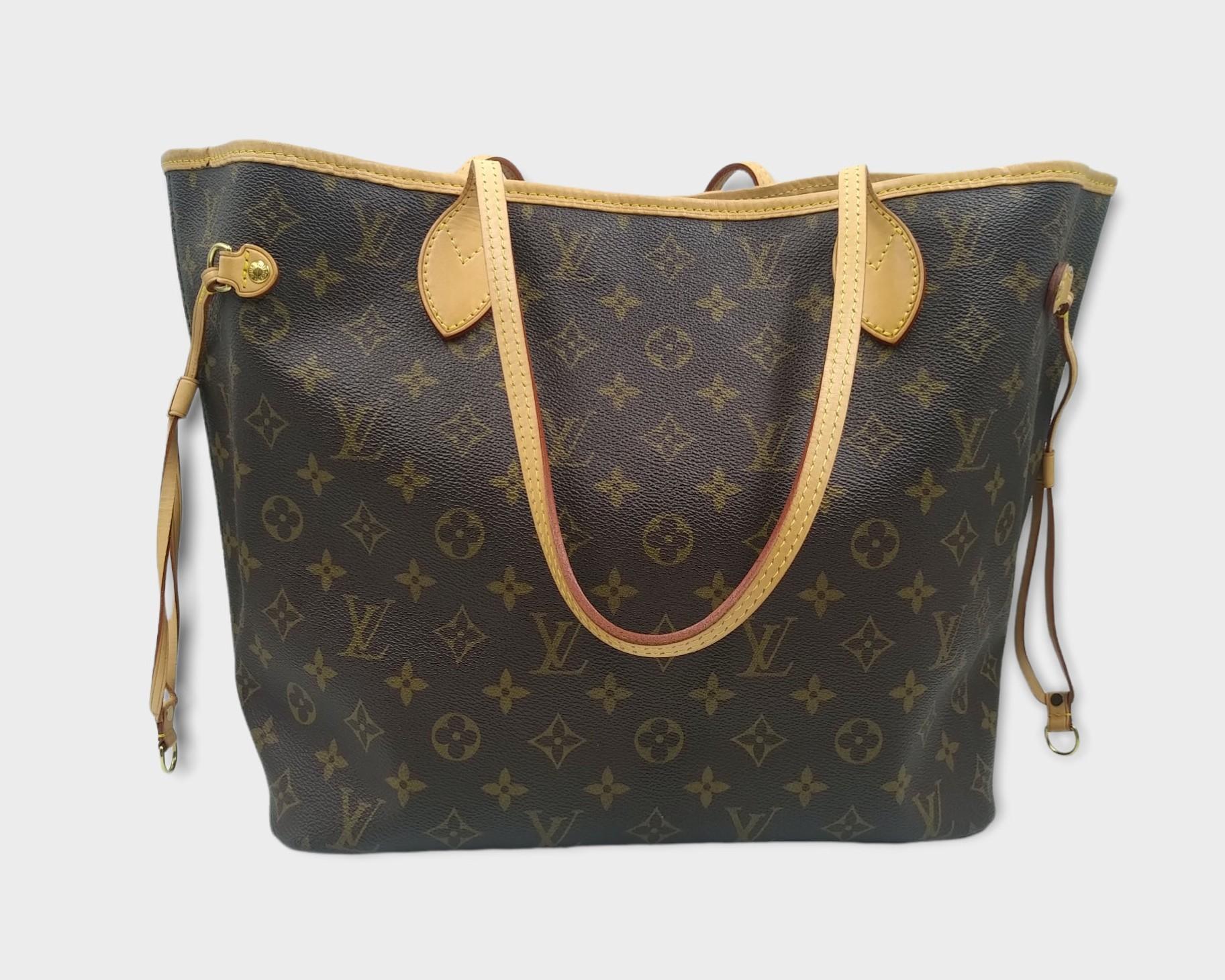 Louis Vuitton Monogram Canvas Neverfull PM Bag, 2007
- 100% authentic Louis Vuitton
- Monogram coated canvas with natural cowhide leather trim
- Double flat leather shoulder straps
- Open top with clasped ban middle hook
- Louis Vuitton canvas