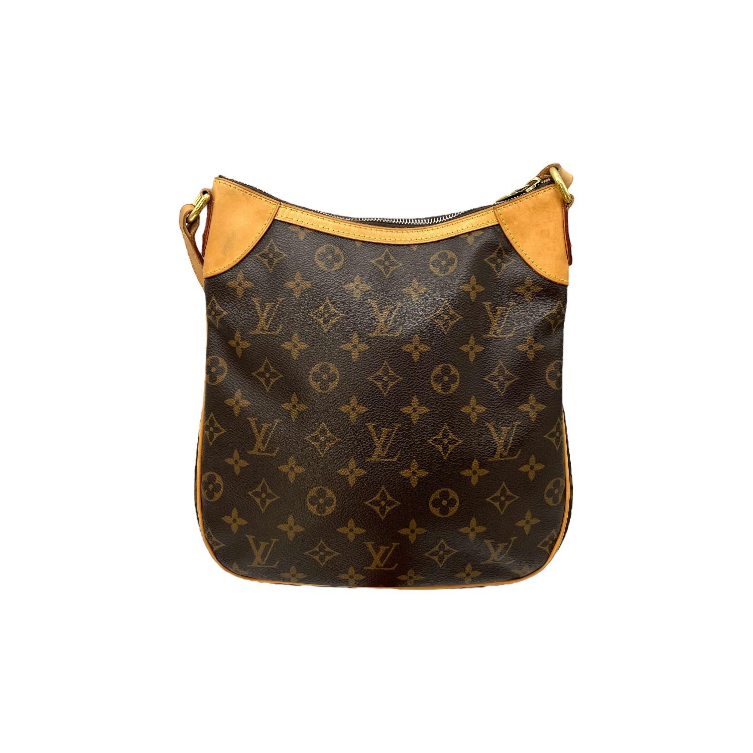 This Louis Vuitton Monogram Odeon PM was made in Spain in 2011 and it is finely crafted of the classic Louis Vuitton Monogram coated canvas with leather trimming and gold-tone hardware features. It has an adjustable flat leather shoulder strap. It