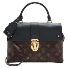 Bolso con solapa MM de lona Monogram de Louis Vuitton con un asa