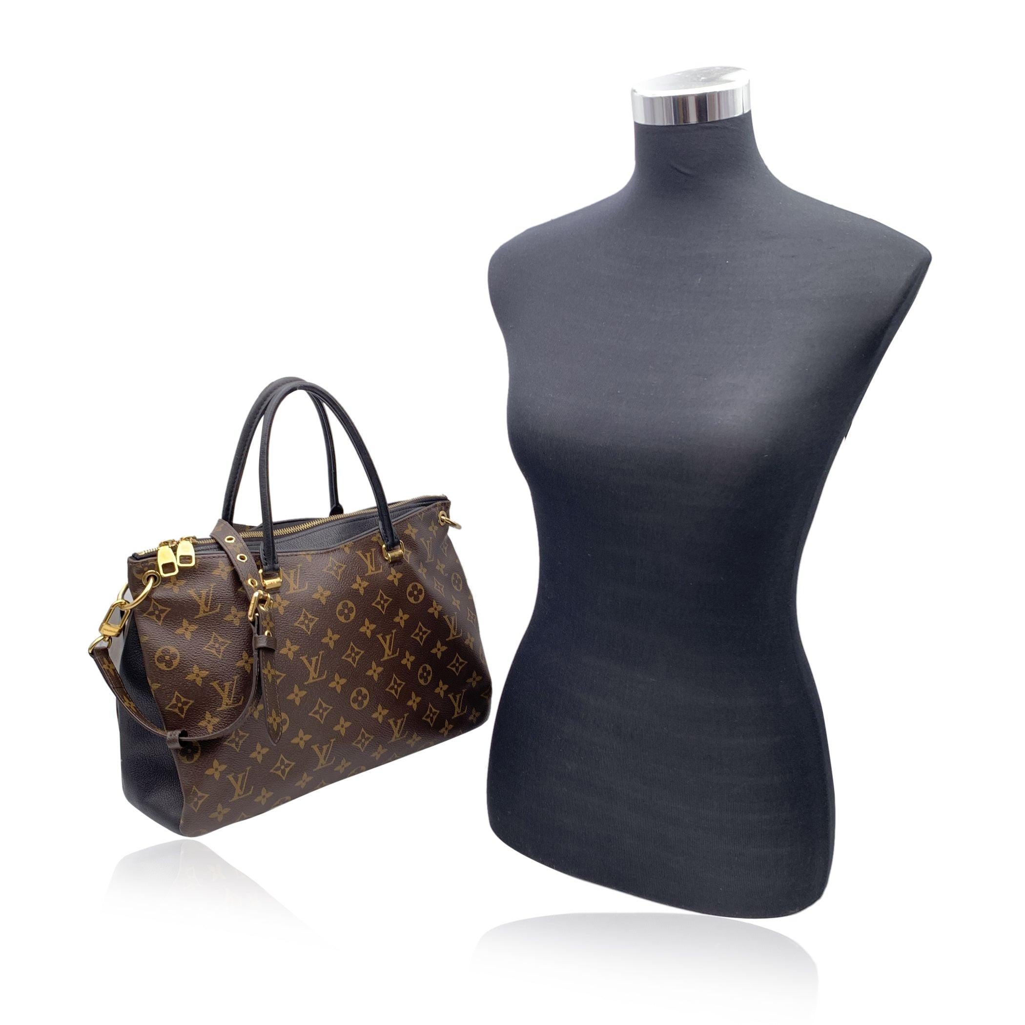 This beautiful Bag will come with a Certificate of Authenticity provided by Entrupy. The certificate will be provided at no further cost Louis Vuitton 'Pallas Full' in monogram canvas with black leather. Black leather handles and monogram canvas