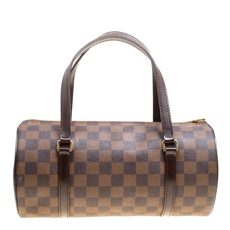 Make a sensational appearance with this highly coveted bag by Louis Vuitton. The Papillon 30 bag is designed in a duffle style from their monogram coated canvas accented with leather trims. The bag has two sleek handles at the top, gold-tone