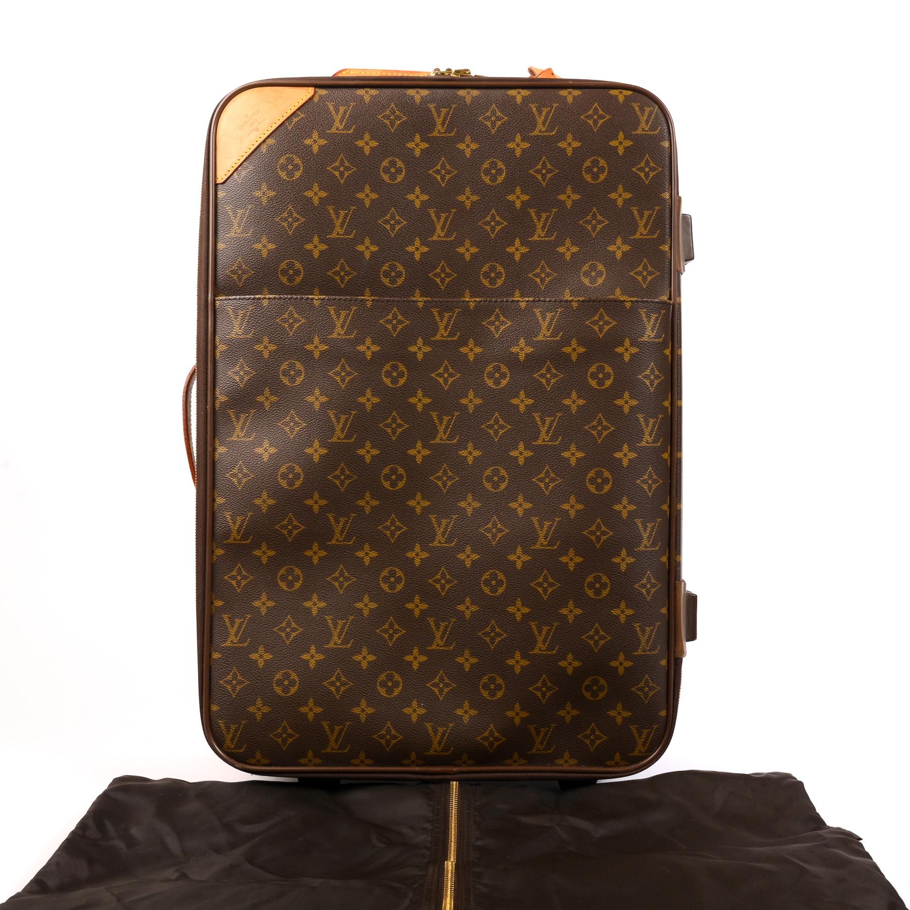 Louis Vuitton Monogram Canvas Pegase 55 Suitcase

This stunning wheeled suit-case is made of monogram canvas with gold hardware. There are two vachetta leather handles in light brown, one on the side and one on the top with a nametag attached. On