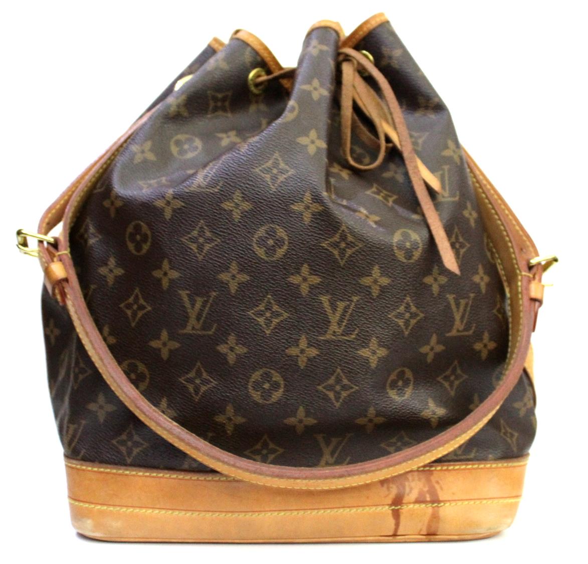 The Louis Vuitton Monogram Canvas Petit Noe Bag is a timeless and favored piece that will never go out of style. It was originally created in 1932 to carry five bottles of Champagne. With its spacious interior and leather drawstring closure, this
