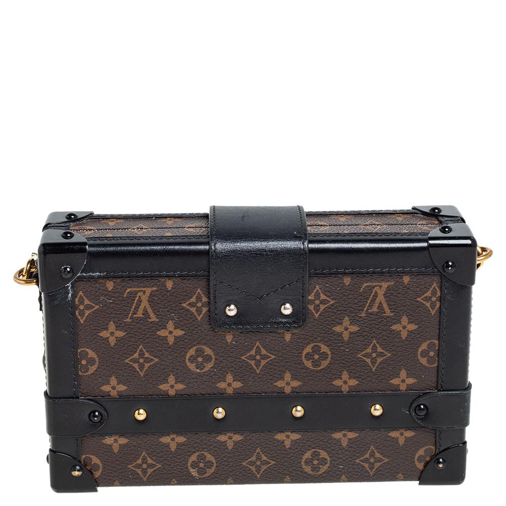 If you're looking for a bag with a blend of modern style and exquisite craftsmanship, this Louis Vuitton Petite Malle Bag is the answer. Crafted from monogram coated canvas and leather, it features armored corners, a band flap with a logo-engraved