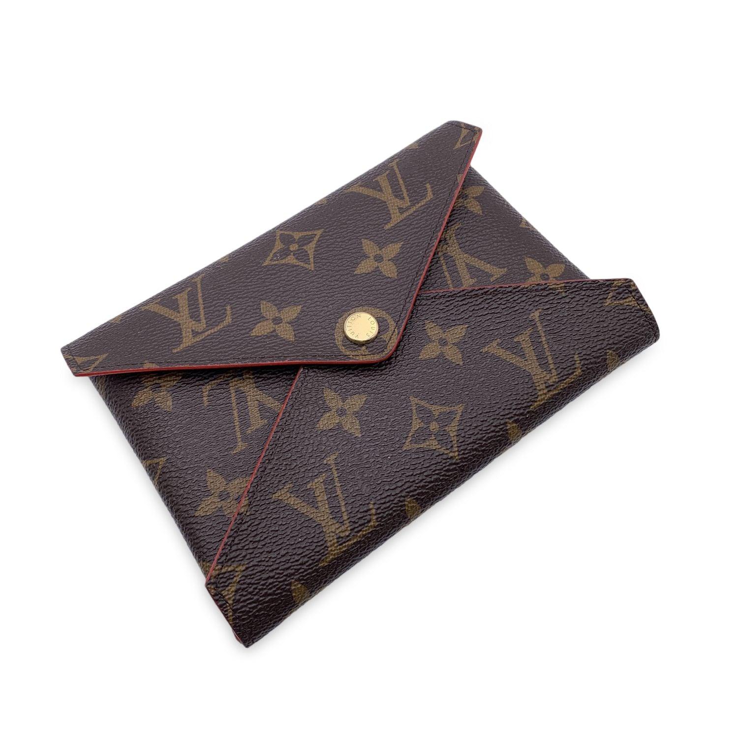 LOUIS VUITTON 'Pochette Kirigami', medium size. Crafted od monogram canvas with red leather interior. The medium model can hold a passport. Flap with button closure. 'Louis Vuitton Paris - Made in France' embossed inside. Condition A - EXCELLENT