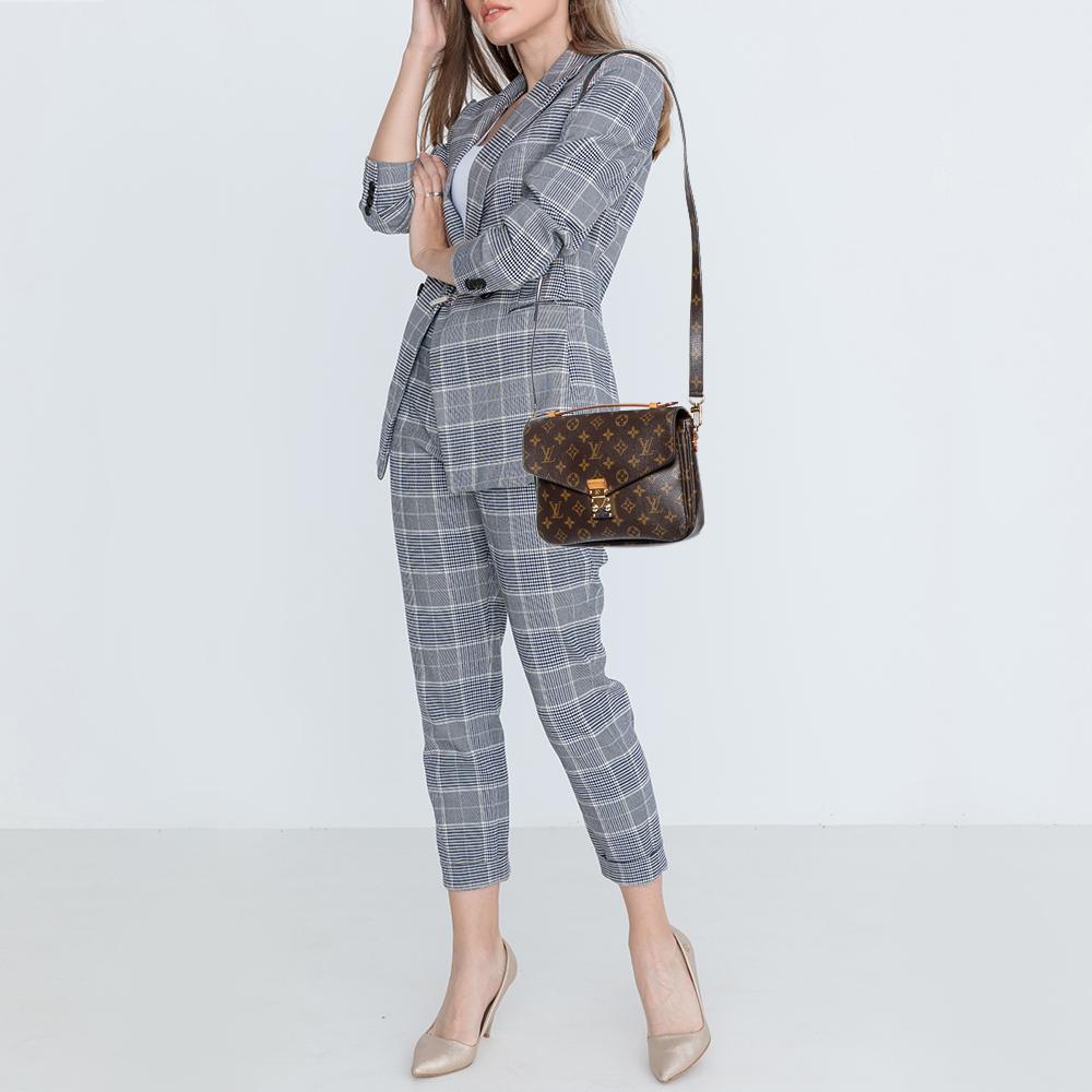 The monogram canvas Pochette Metis is a modern-day essential. A top handle and an adjustable Monogram canvas shoulder strap are provided for versatile styling. This eye-catching bag from Louis Vuitton is worth investing in.

Includes: Original
