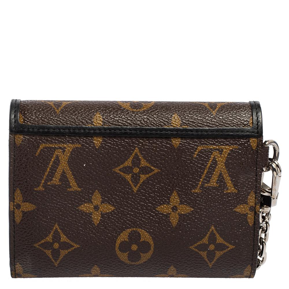 This LV wallet is very classic, chic, but also very practical. It is endowed with striking gold-tone hardware including studs on the front flap and a chain on the side adding to its modern look. It also features a functional interior.

Includes:
