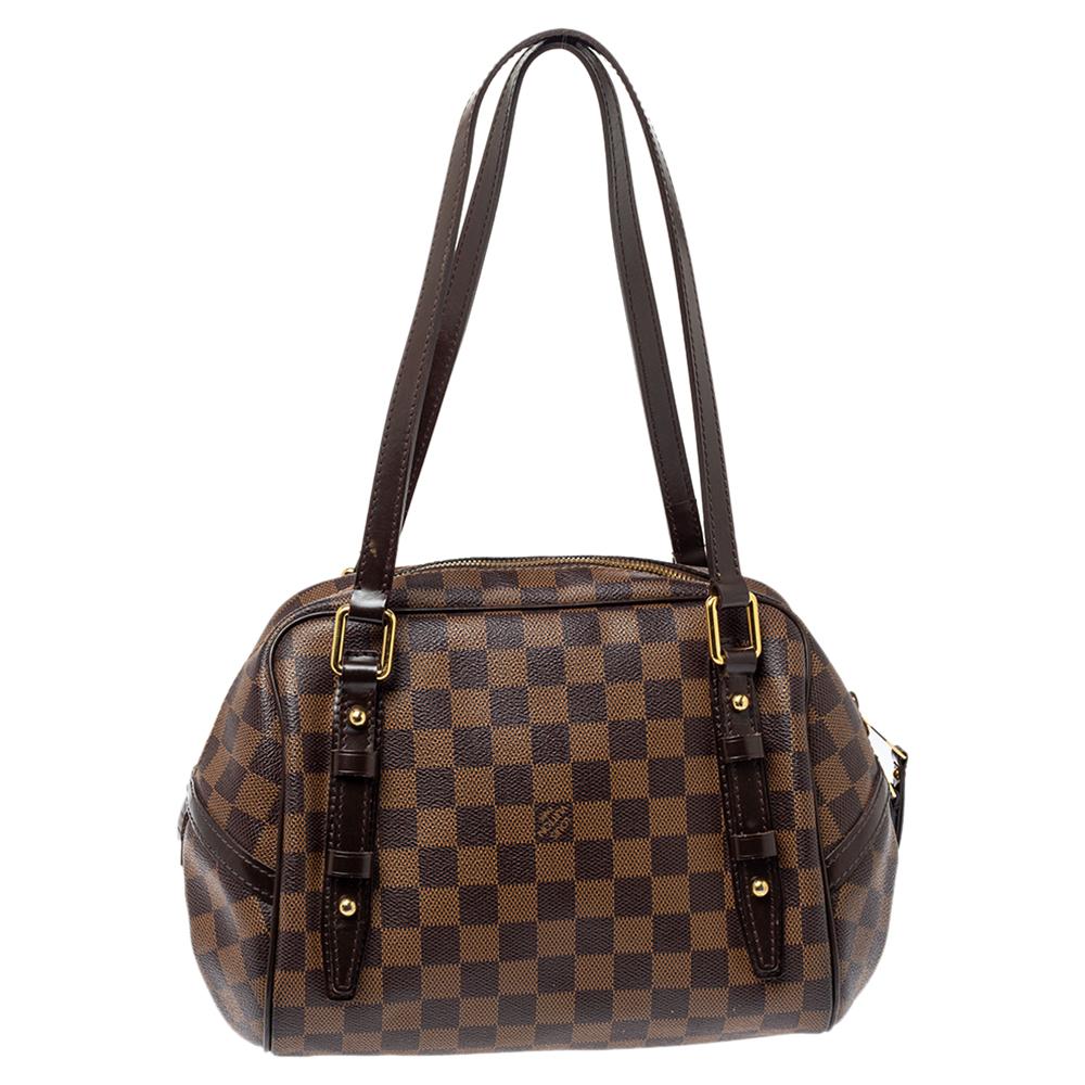 Louis Vuitton has been a leading fashion house for apparel and accessories alike. The brand has outdone itself yet again with this Rivington PM bag that is crafted out of brown Monogram canvas. Featuring two long handles, the bag has a single zip