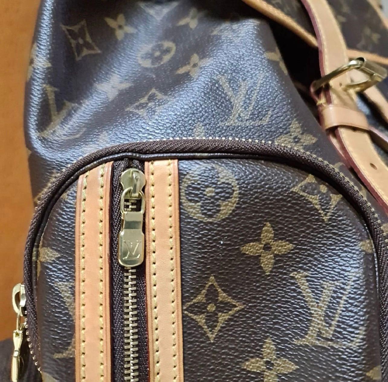 This striking Louis Vuitton Monogram Canvas Sac a Dos Bosphore Backpack Bag is great for ultimate hands-free convenience. 
The size and multiple pockets and ultra spacious interior makes it perfect for carrying all of your essentials in style and
