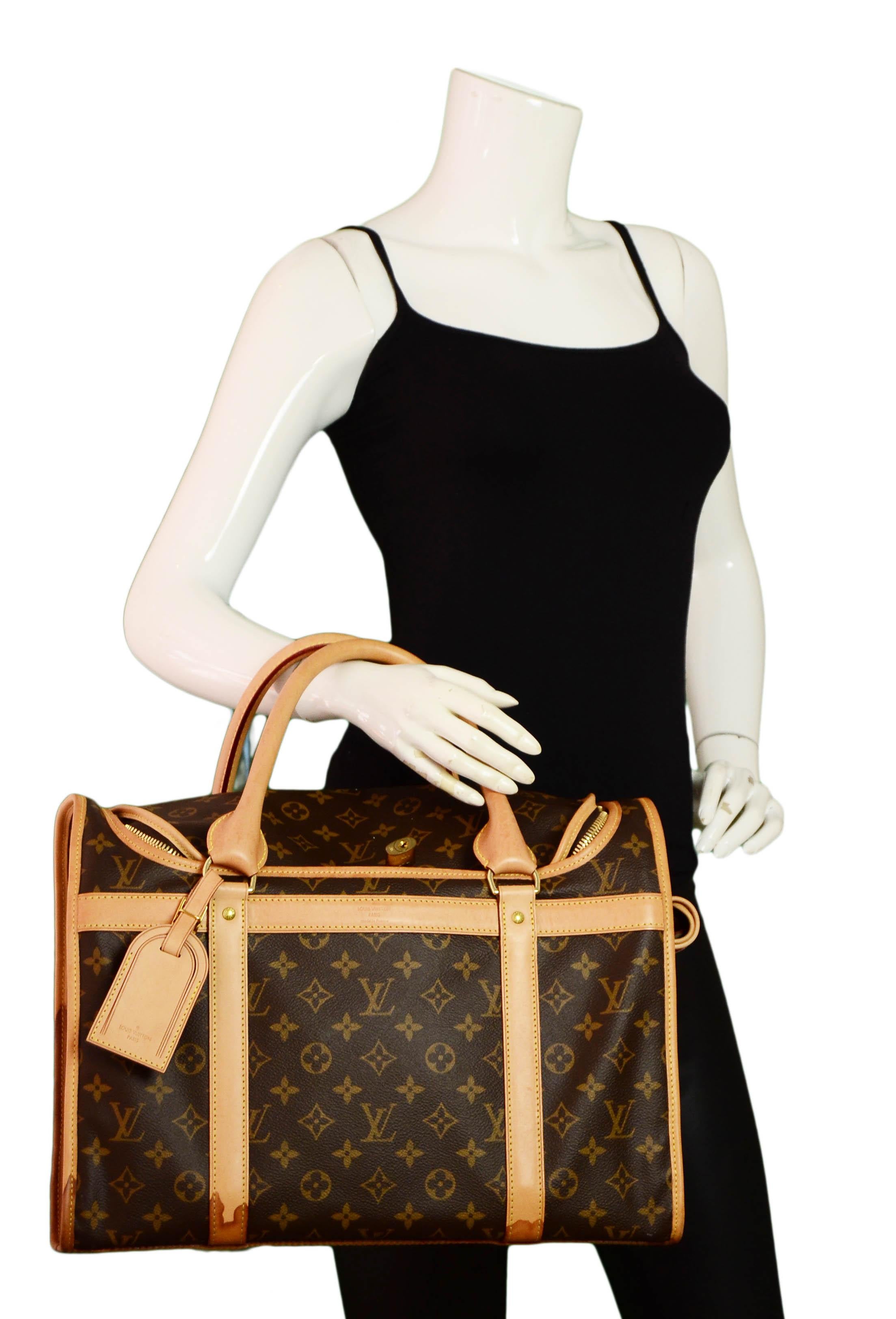 Louis Vuitton Monogram Canvas Sac Chien 40 Dog Carrier Pet Travel Bag.  Features breathable mesh window that can be covered with roll-up flap and snaps.

Made In:France
Year of Production: 2019
Color: Brown
Hardware: Goldtone
Materials: Coated