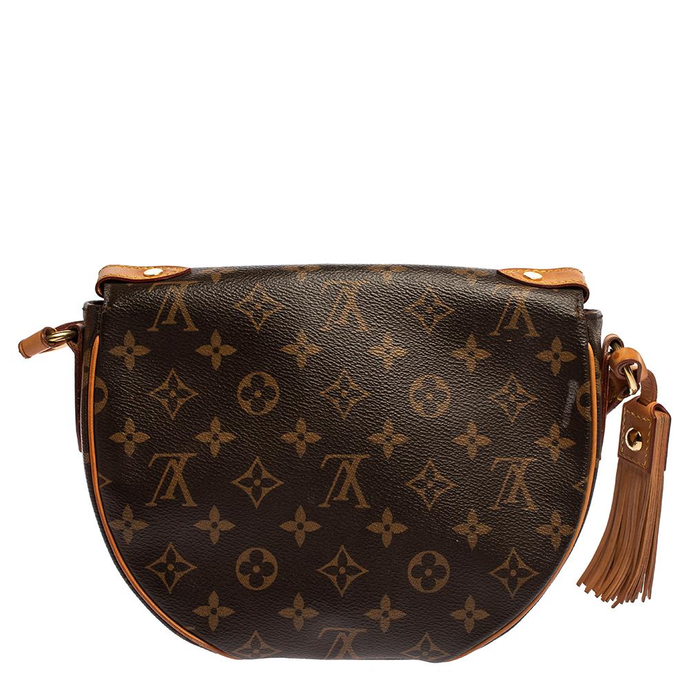 Crafted from Monogram canvas & leather, this Louis Vuitton Saint Cloud bag is a closet essential. It features a flap design with a snap closure that opens to a canvas-lined interior with enough space. It is further adorned with an embossed logo