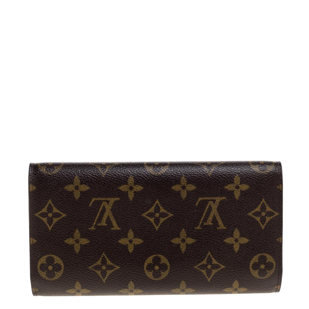 One of the most famous wallets by Louis Vuitton is Sarah. This one here comes made from monogram coated canvas and the button on the flap opens to an interior with multiple card slots and a flap pocket. Perfect in size, this wallet can easily fit
