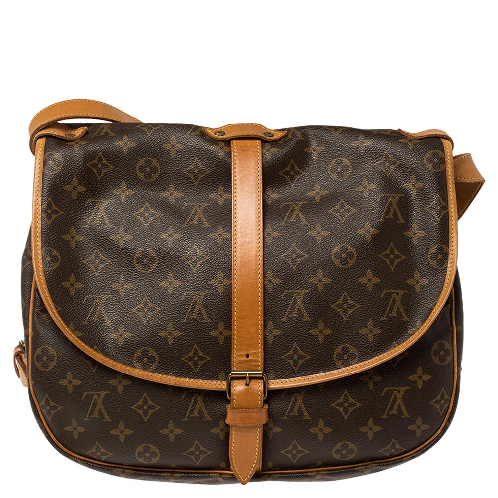 Inspired by equestrian ‘SADDLE’ design, this legendary messenger bag by Louis Vuitton is crafted from monogram canvas and will never go out of style. This bag features dual compartments, held together tightly with belts on the sides. Its adjustable