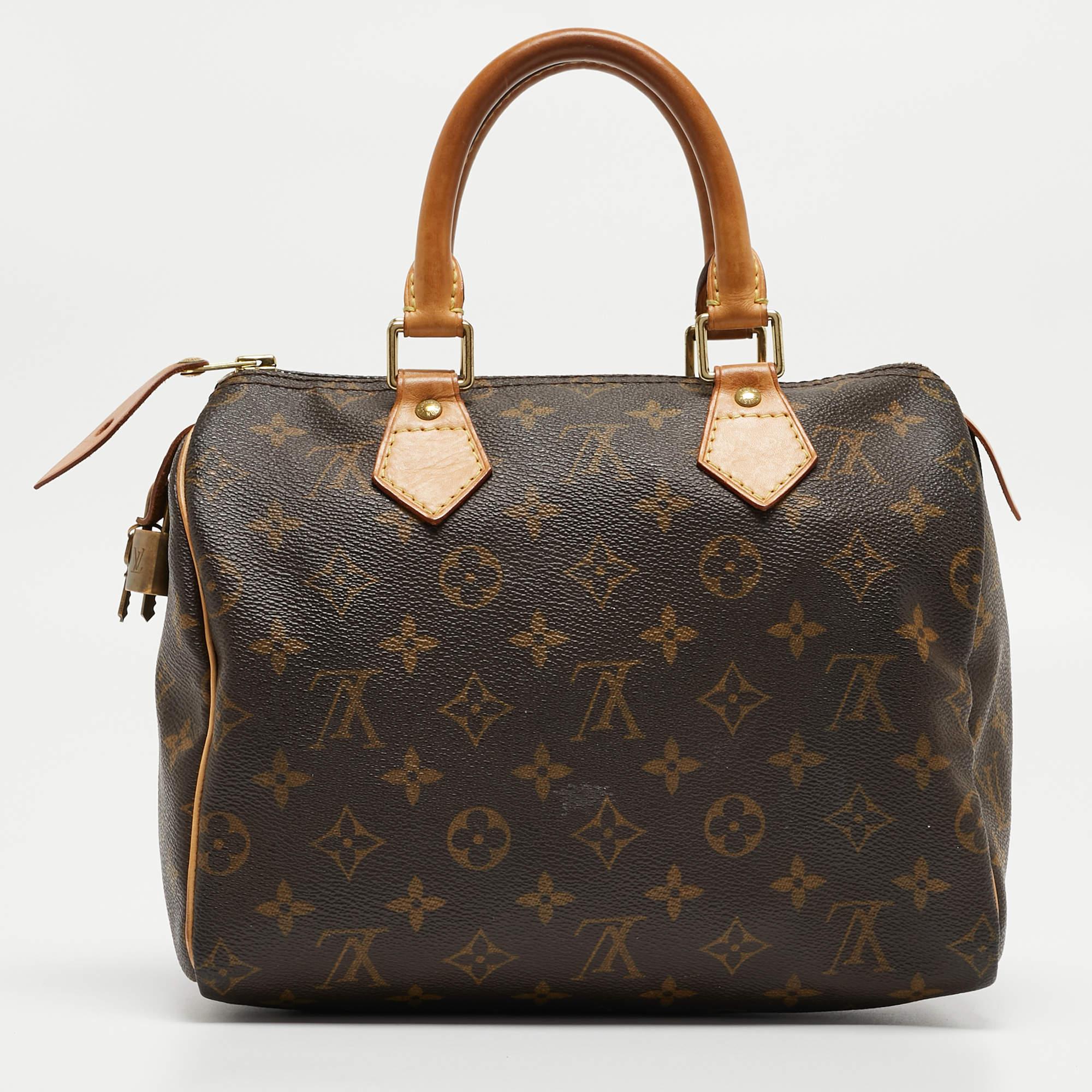 The Louis Vuitton Speedy 25 Bag exudes timeless elegance with its iconic monogram print on durable canvas. Its compact size makes it perfect for everyday use, while the luxurious leather trim and gold-tone hardware add a touch of
