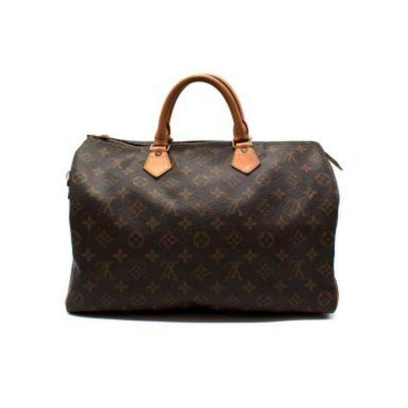 Louis Vuitton Monogram canvas Speedy 35 bag

-Rolled top handle 
-Zip fastening opening 
-Logo body 
-Lock and key detail
-Interior wall pocket 

Material:

Leather 

Made in France 

Great vintage condition, please carefully view the