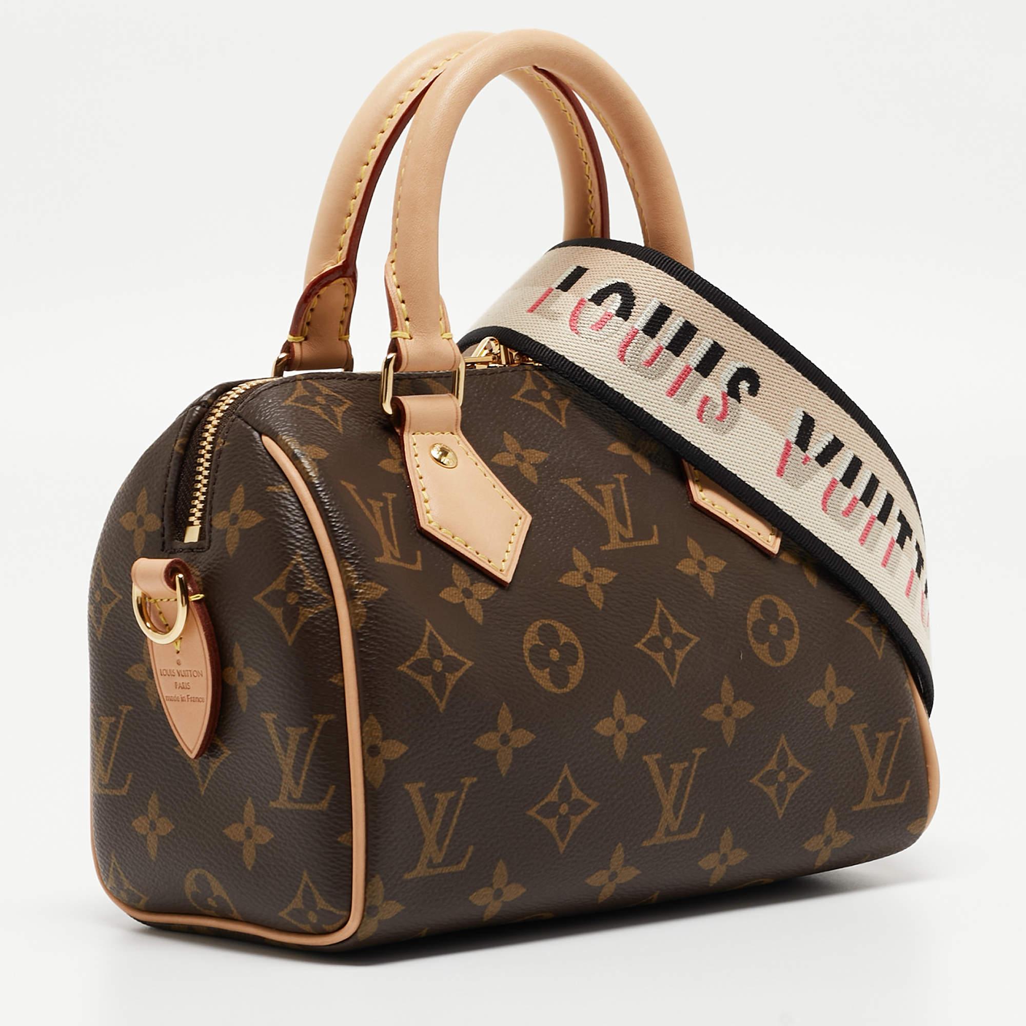 The Louis Vuitton Speedy Bandouliere 20 Bag exudes timeless elegance with its iconic monogram pattern on coated canvas. This compact handbag features vachetta leather trim, a detachable and adjustable shoulder strap, and a zip-top closure, making it