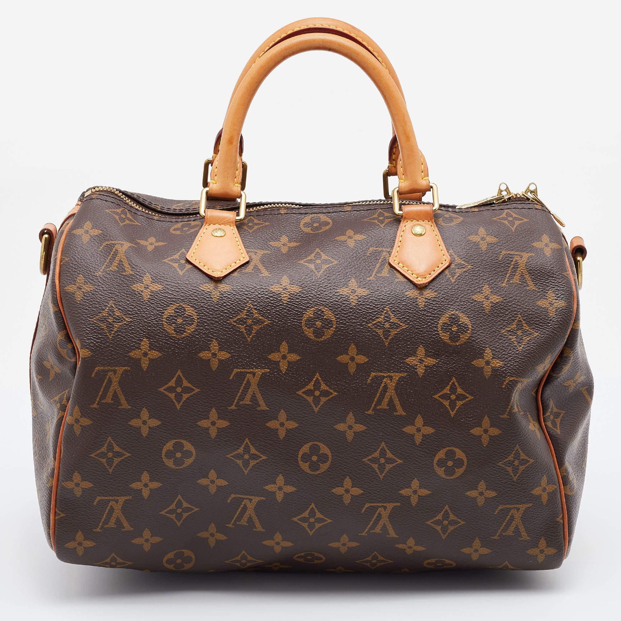 Titled one of the greatest handbags in the history of luxury fashion, the Speedy from Louis Vuitton was first created for everyday use. This Speedy 30 comes crafted from coated canvas and leather with two handles and a top zipper leading to a