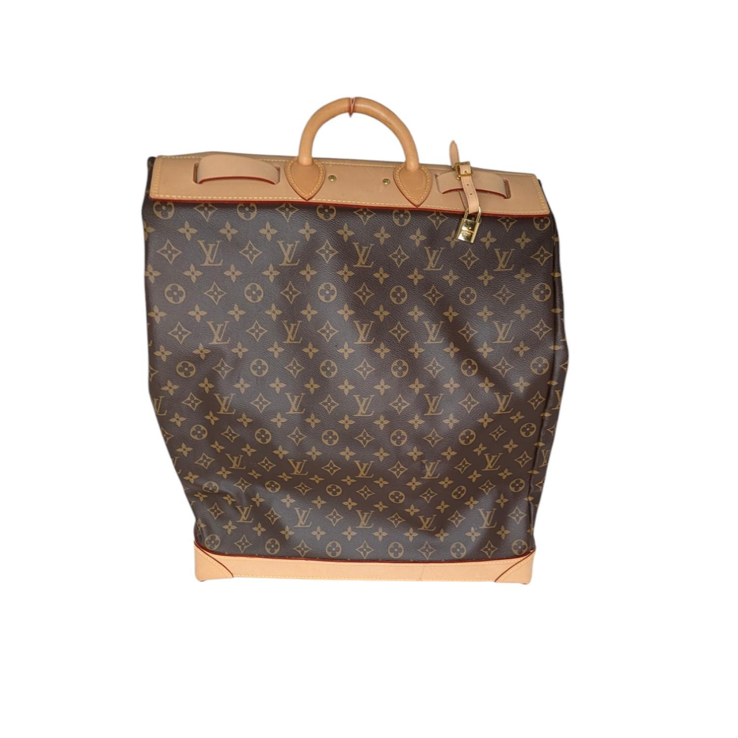 This travel bag in Monogram canvas offers a large storage space. Its base features protective feet and a leather strap makes its closure more secure. Current Retail $5,950.

Designer: Louis Vuitton
Material: Monogram canvas; Natural cowhide-leather