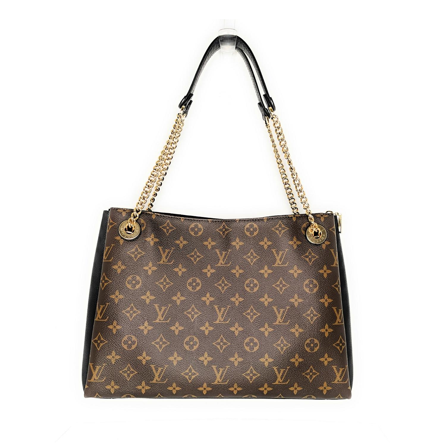 From the 2019 collection. Brown and tan Monogram coated canvas Louis Vuitton Surène MM with brass hardware, dual chain-link shoulder strap with leather shoulder guards, black coated canvas panels at sides, protective feet at base, Alcantara lining,