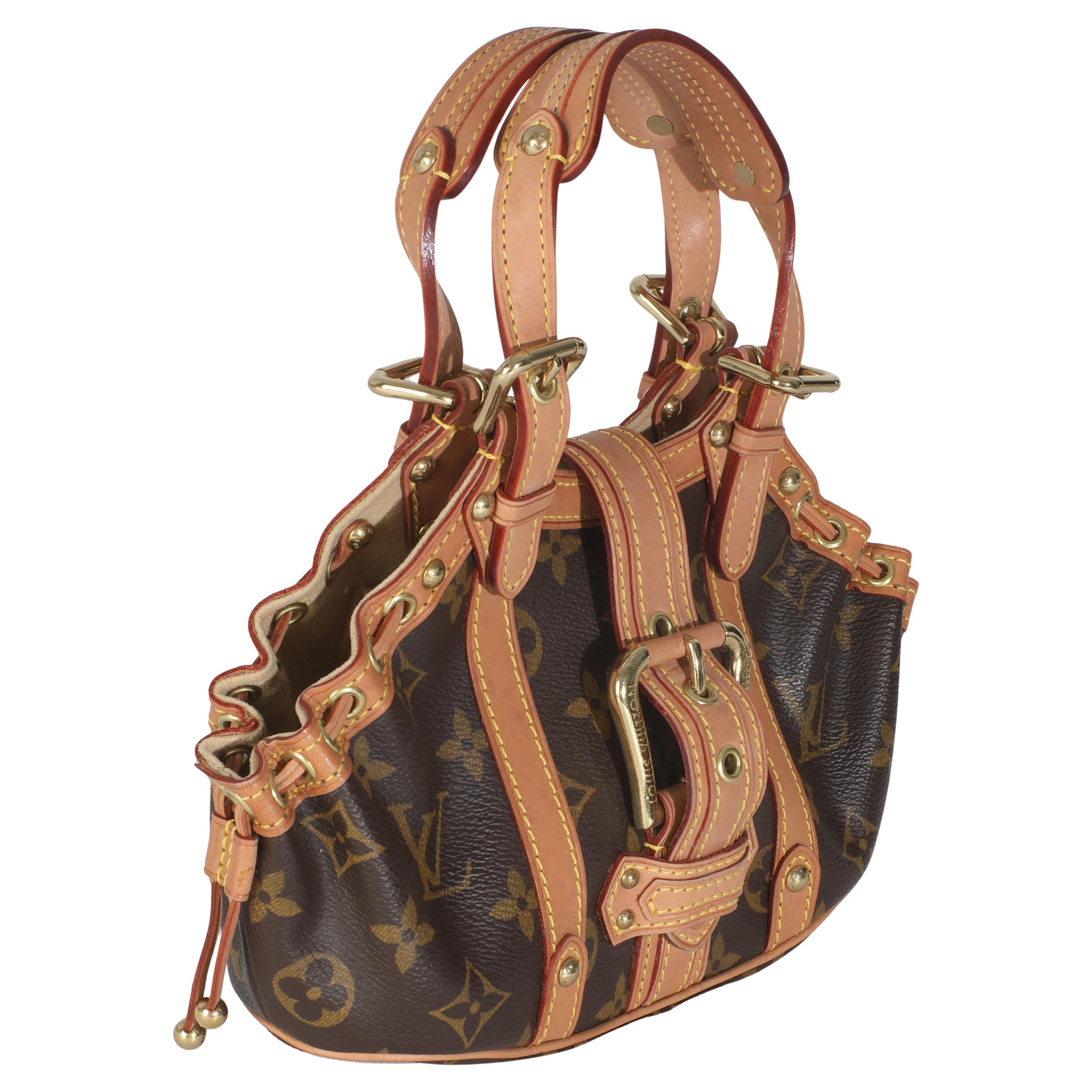 Listing Title: Louis Vuitton Monogram Canvas Theda PM
SKU: 145835
Condition: Pre-owned 
Handbag Condition: Very Good
Condition Comments: Item is in very good condition with minor signs of wear. Watermarks along leather. Scratching and tarnishing