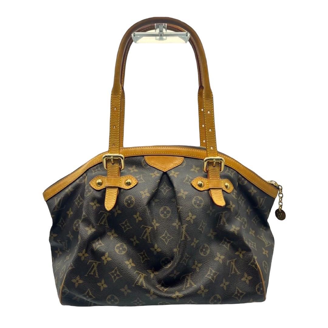 We are offering this Louis Vuitton Monogram Tivoli GM shoulder bag. Made in France in 2008, this bag's exterior is crafted of Louis Vuitton's signature LV monogram coated canvas, leather trim details, adjustable leather top handles, and brass