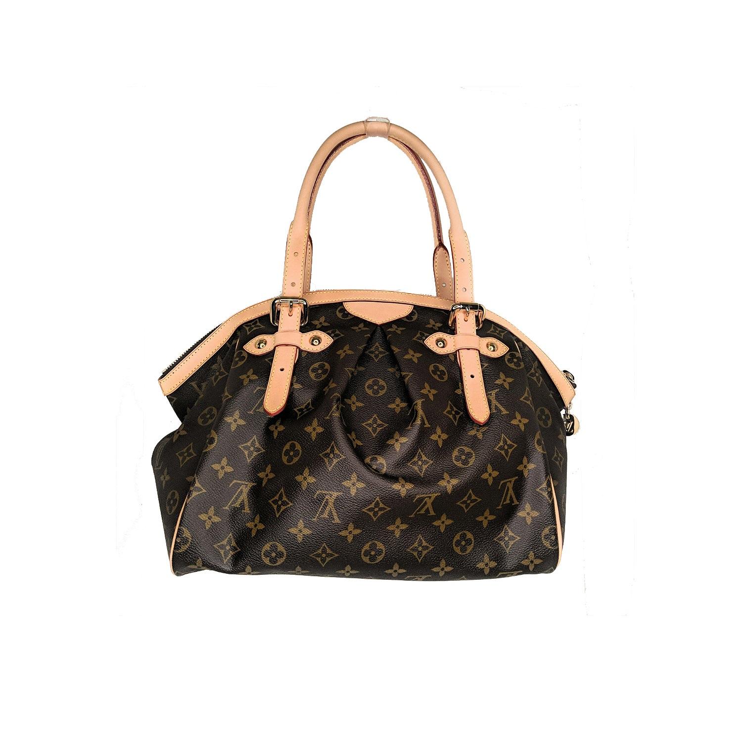 This unique Louis Vuitton Monogram Canvas Tivoli GM Bag is the one for you. The Tivoli, whose name was inspired by the famous city of Tivoli, Italy, features stylish details such as an inverted pleating, a frame top and a gold-tone zipper LV pull.