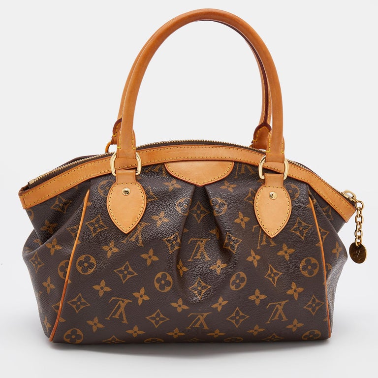 A Louis Vuitton Tivoli Top-Handle Bag. Brown LV monogram canvas. Leather  trim with gold-tone hardwar