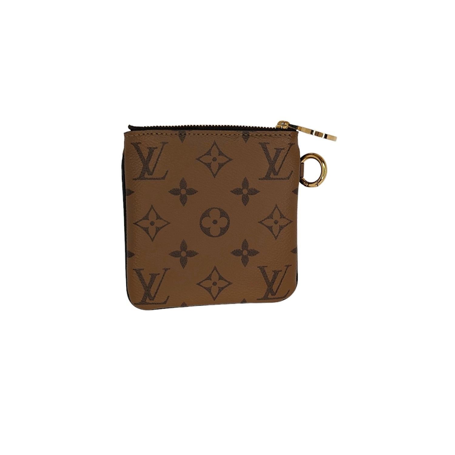 Two Pouches is an ingenious design combining two variations of Louis Vuitton's iconic Monogram canvas. Ideal for essentials, the pouches can be used together or separately, and carried in the hand or attached to a bag or belt. They are secured with