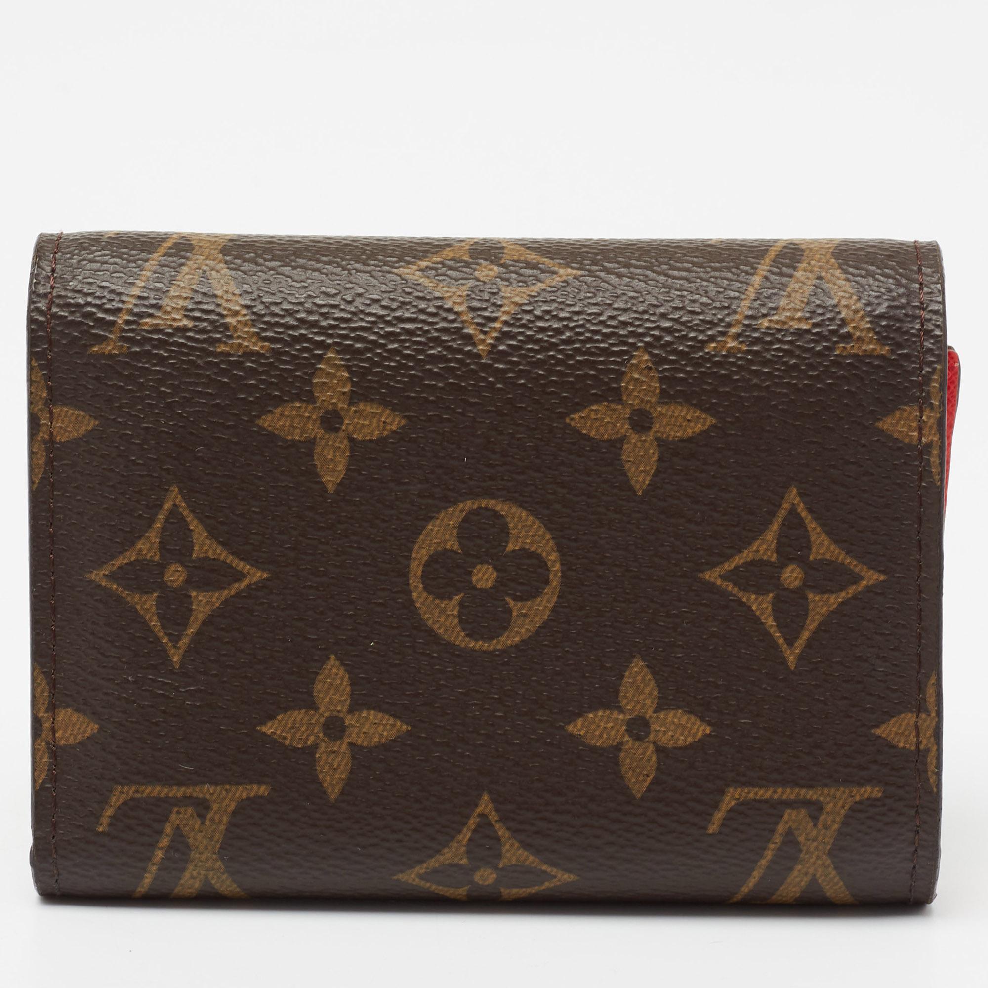 This Louis Vuitton wallet is playful and trendy in design. Created from the monogram canvas, it is made striking with a bird face on the front and flaunts gold-tone hardware. Its compartmentalized interior will keep your cash and card in order.

