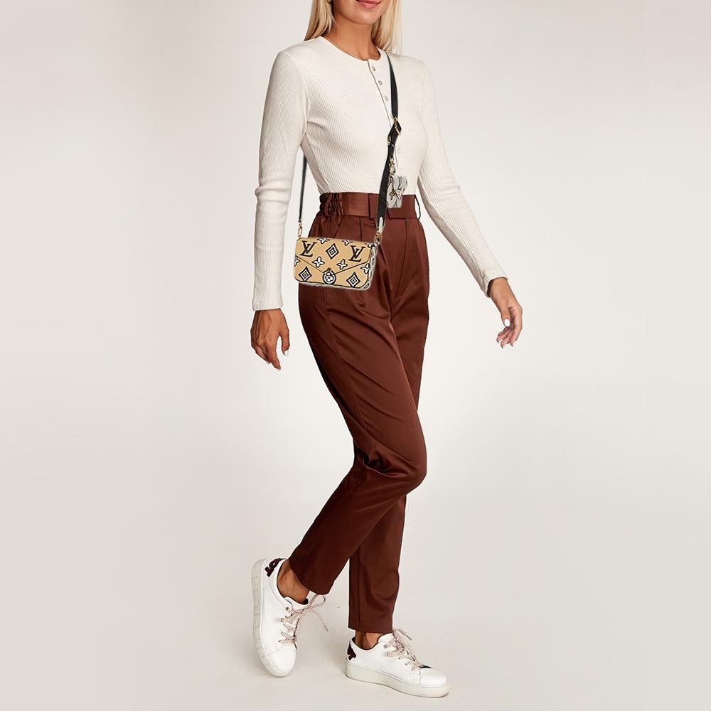 Louis Vuitton's Felicie Strap & Go pochette is presented in a statement-making look under the Wild at Heart edition wherein the iconic monogram is shown in an animal print twist. The bag is made of monogram canvas and held by a crossbody