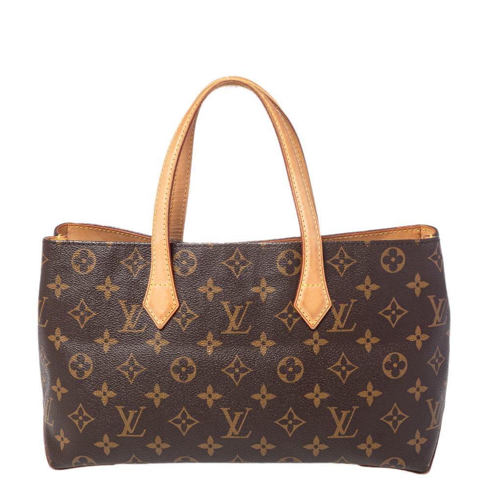 Louis Vuitton's handbags are popular owing to their high style and functionality. This Wilshire bag, like all the other handbags, is durable and stylish. Crafted from monogram coated canvas and leather, the brown bag comes with dual handles and a