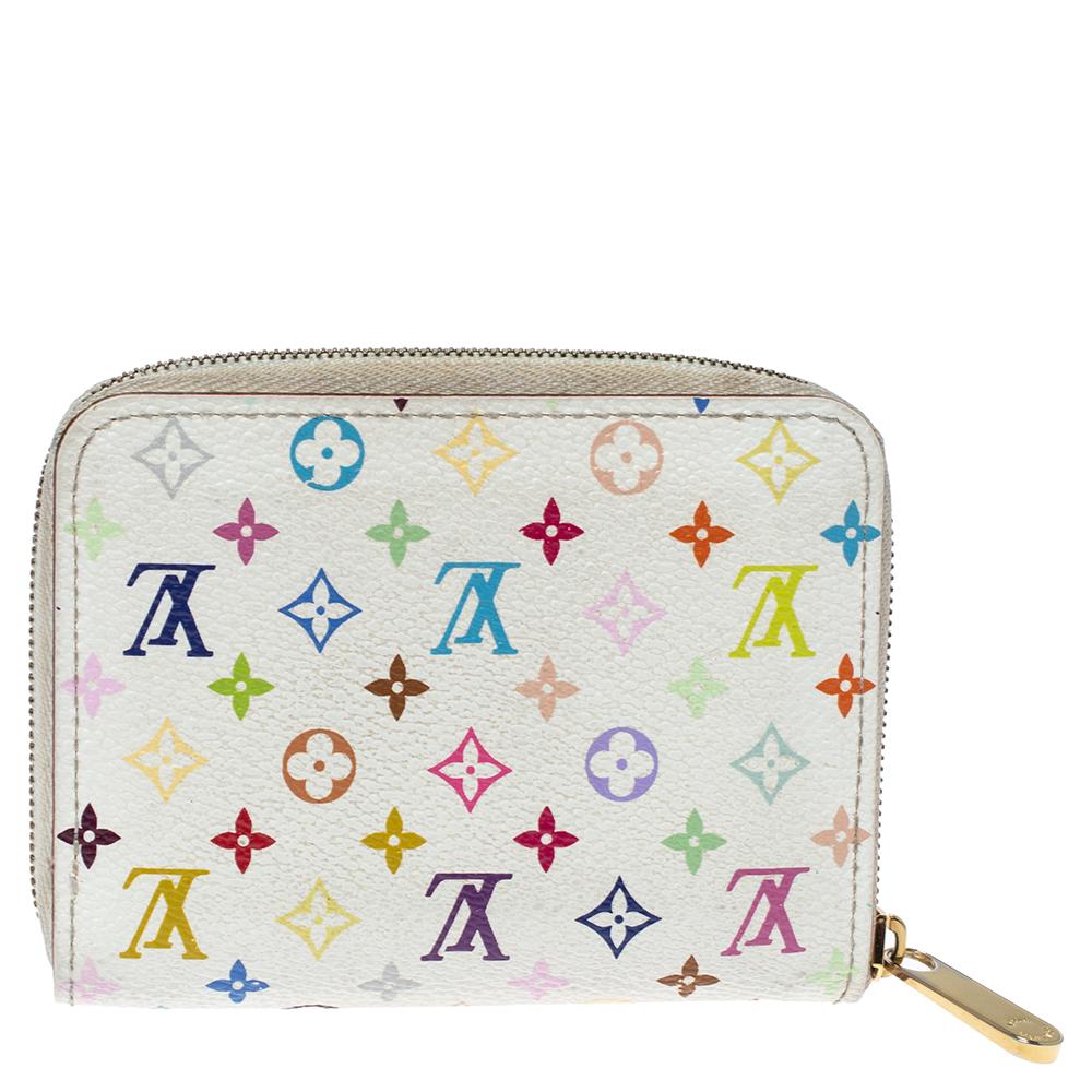 Dieses Louis Vuitton Zippy Portemonnaie ist ein praktisches Accessoire für den täglichen Gebrauch. Das Portemonnaie aus farbenfrohem:: mit Monogramm beschichtetem Canvas hat einen Reißverschluss:: der sich öffnen lässt:: um mehrere Fächer zum Ordnen