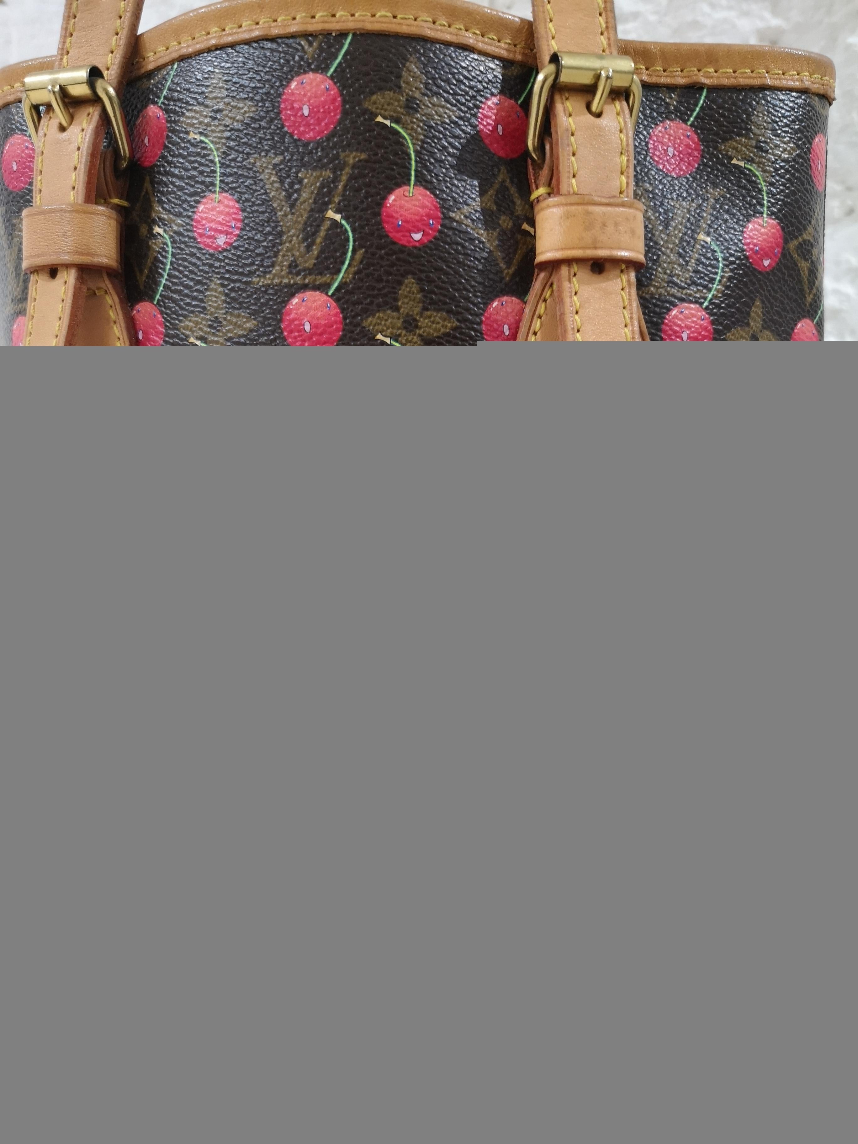 Louis Vuitton Monogram Cherry Bucket Bag
Limited edition  designed by Takashi Murakami 
This popular bucket bag style has the iconic monogram canvas adorned with bright cheerful cherries. 