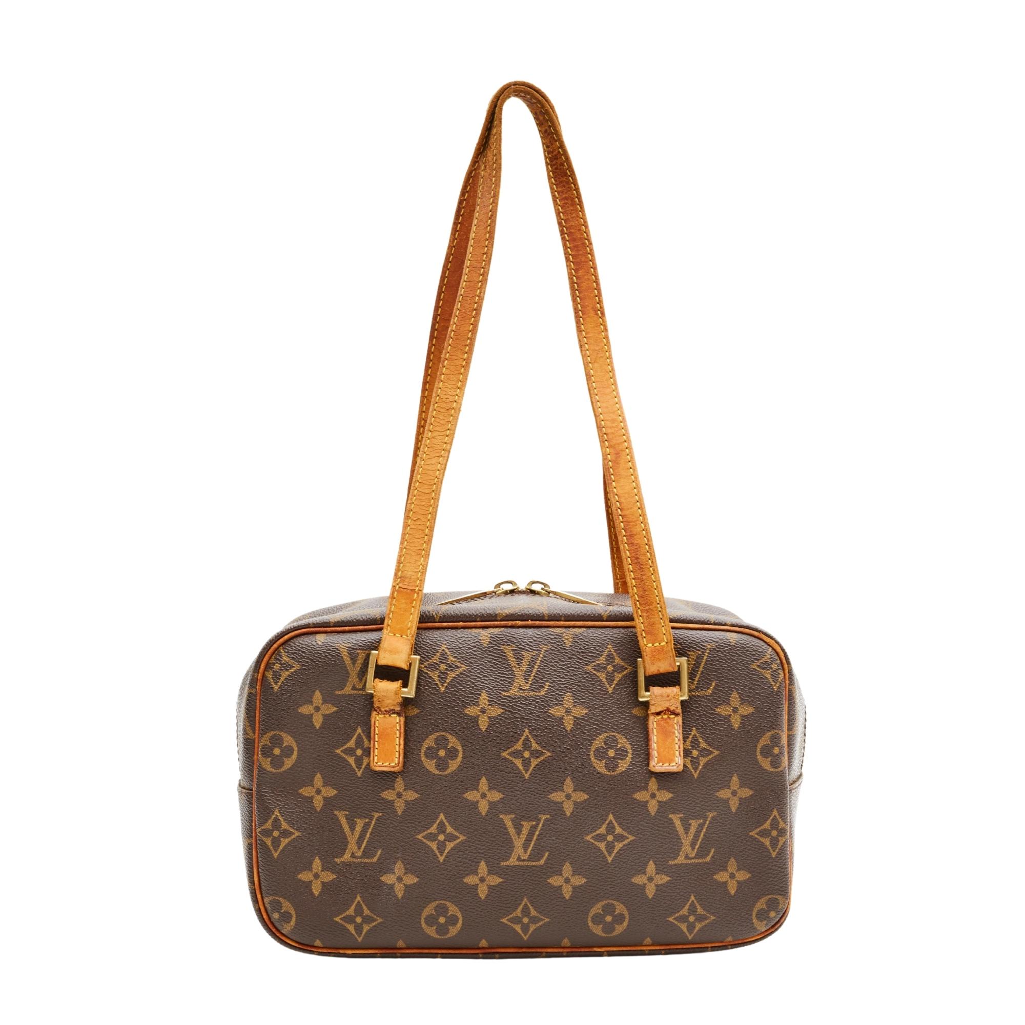 This bag is made with brown monogram coated canvas with nice light caramel natural leather finishes. The bag features a front zip compartment, top zip closure with double zippers, dual flat top handles and a terra-cotta cross grain leather