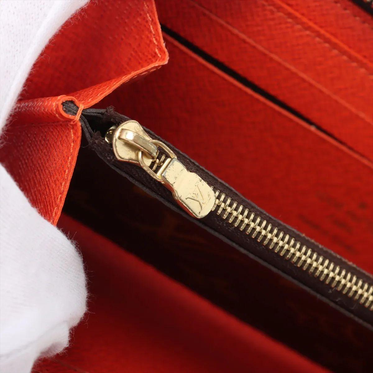 Louis Vuitton Portafoglio Monogram Clemence Marrone x Arancione in vendita 5