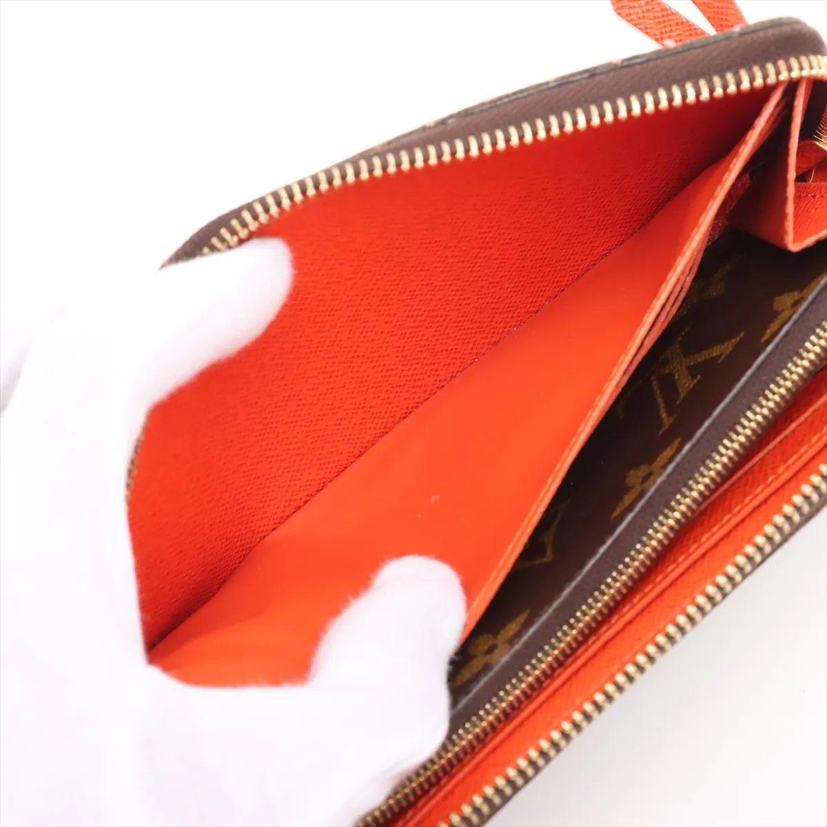 Louis Vuitton Portafoglio Monogram Clemence Marrone x Arancione in vendita 1