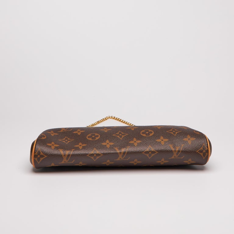 Sold at Auction: A LOUIS VUITTON MONOGRAM MOTARD AFTERDARK CLUTCH BAG. FROM  THE 2008 COLLECTION BY MARC JACOBS. MADE OF BROWN SUEDE, BRASS HARDWARE,  CUTOUT HANDLES. OPEN TOP WITH INTERIOR POCKET. PLEASE